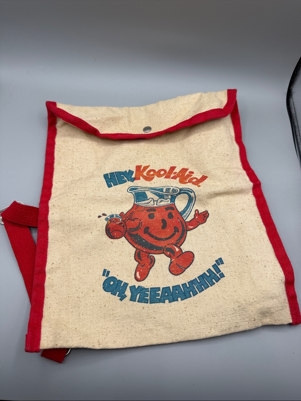Vintage Canvas Hey Kool-Aid “Oh Yeeaahhh!” Back Pack Red Trim Metal Snap Closure
